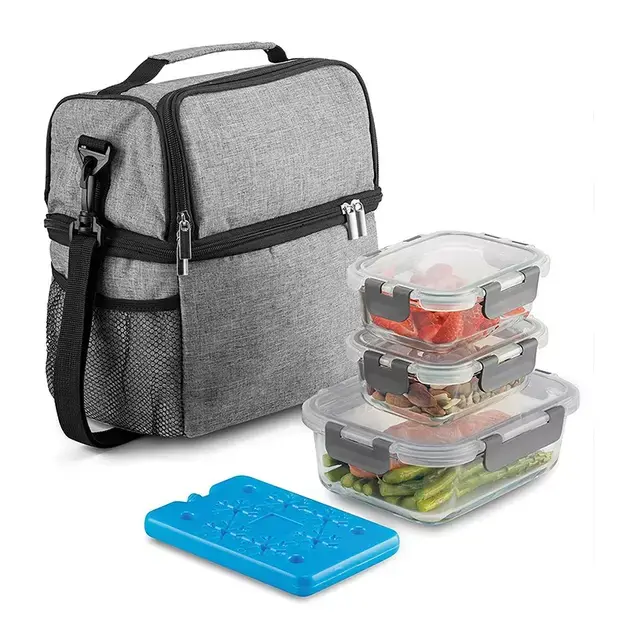 Gray insulated lunch bag with shoulder strap, three stackable glass containers with food, and a blue ice pack.