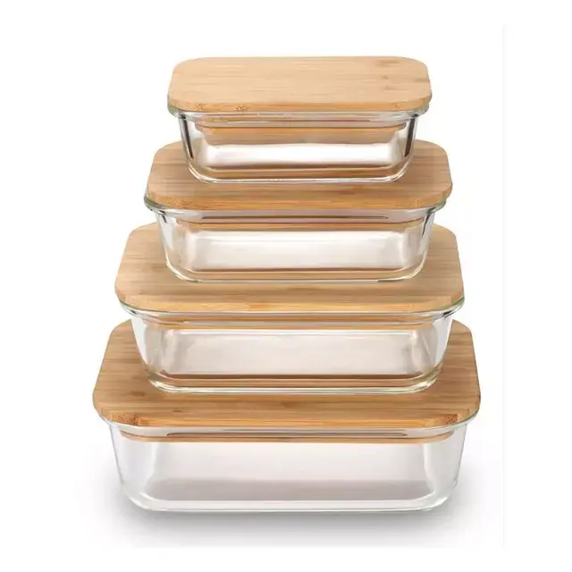 Four glass containers with bamboo lids stacked on top of each other, showcasing storage solutions for kitchen organization.