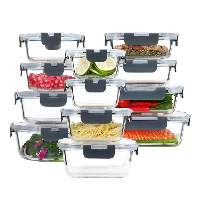 Stack of glass food storage containers with various colorful foods, each with grey lids, showcasing diverse kitchen storage options.