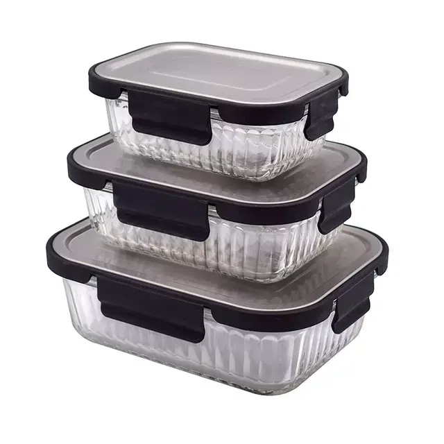 Three rectangular glass food containers stacked, featuring black lids and secure locking clips, ideal for kitchen storage.