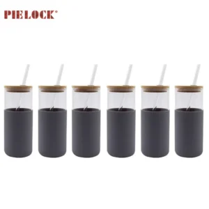 Set of six glass tumblers with black sleeves, bamboo lids, and white straws, arranged in a row.