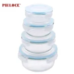 Four stackable round glass containers with blue airtight lids, ideal for kitchen storage.