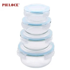 Four stackable round glass containers with blue airtight lids, ideal for kitchen storage.