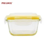 Clear glass food container with a yellow airtight lid, ideal for kitchen storage. Features the brand name Pielock.